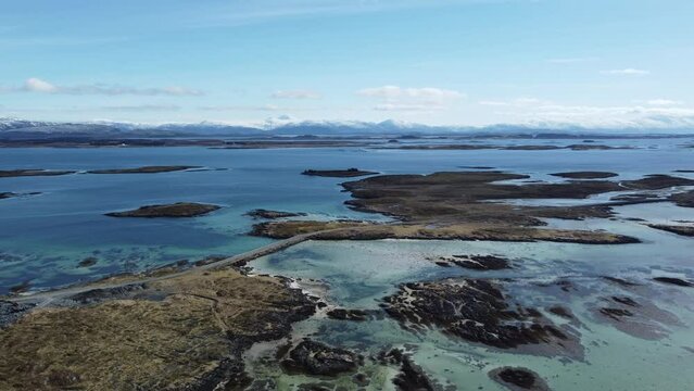 archipelago in nordland with view of Tennes on the island of Heroy in warming sunlight