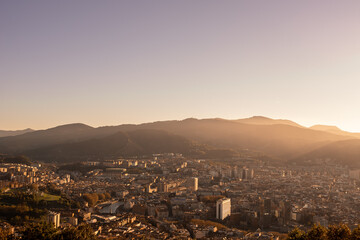 Aerial view of the city and the mountains with clear skies