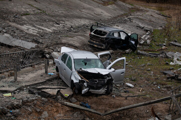 Cars that fell from a bridge blown up by the Russians