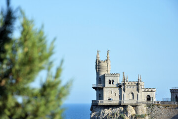 Fototapeta na wymiar Castle Swallow's Nest on a rock at Black Sea, Crimea, Russia. It is a symbol and tourist attraction of Crimea