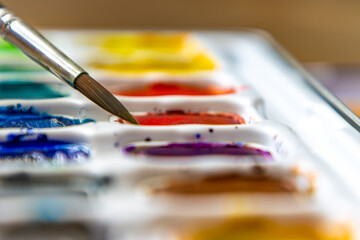 Watercolor paint brush and palette