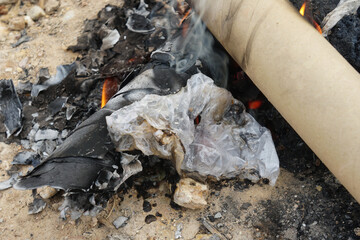 The plastic bag caught fire, produced white smoke, and produced a foul smell. cause of air pollution