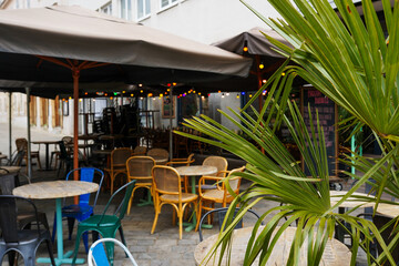 Obraz premium Street view with cafe terrace during the morning in european city