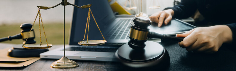 Business and lawyers discussing contract papers with brass scale on desk in office. Law, legal...