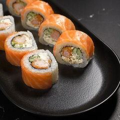 Philadelphia sushi roll with salmon, cucumber, shrimp, cream cheese. Sushi menu. Japanese food