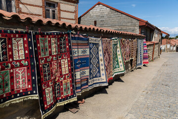 Fototapeta na wymiar A small market selling Georgian handmade carpets