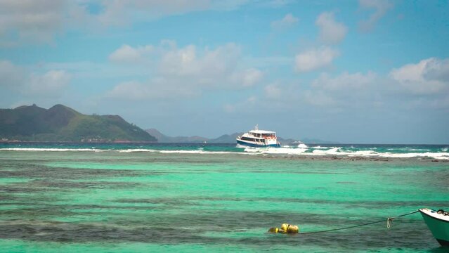 Ferry sailing towards Praslin Island from La Digue island in Seychelles