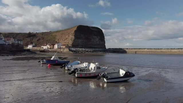 Low tide at Staithes, Yorkshire with fishing boats