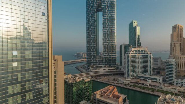 Dubai Marina skyscrapers and JBR district with luxury buildings and resorts aerial timelapse