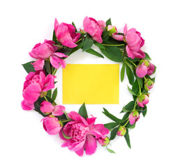 Round garland of beautiful pink peonies on white isolated background with postcard for congratulations or invitations. Creative floral wreath.
