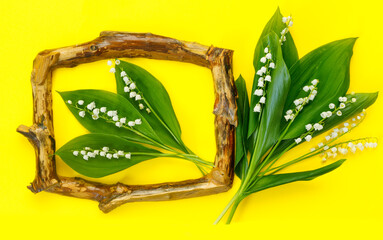 Obraz premium Greeting card for mother's day with bouquet of tender lilies of the valley with wooden frame