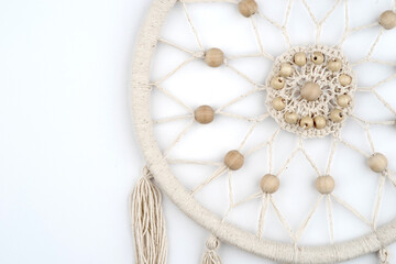 Dreamcatcher handmade spider net or web charm on willow hoop, string, beads. Native crafts items in boho style. Decorative ornament abstract background
