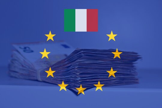 Pile of fifty euros on the table with the European Flag and the Italian Flag, concept of financial help to Italy