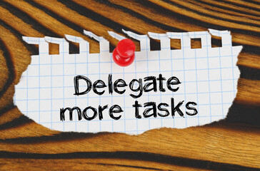 Attached to the board is an announcement with the inscription - Delegate more tasks