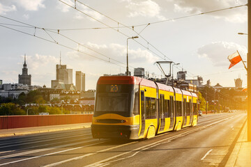 Tram in the city. Public transport concept. Warsaw, Poland - obrazy, fototapety, plakaty