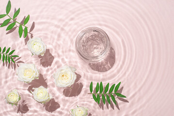 Obraz na płótnie Canvas Jar of hydrating gel and flowers.