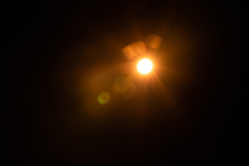 Solar lens flare on black background