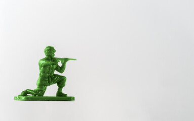Green Plastic toy soldier American Paratrooper in a prone position with rifle