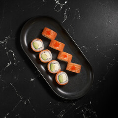 Philadelphia sushi roll with salmon, avocado, cream cheese. Sushi menu. Japanese food