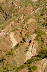 Fototapeta na wymiar Hillside showing its different strata. Vallehermoso. La Gomera. Canary Islands. Spain.