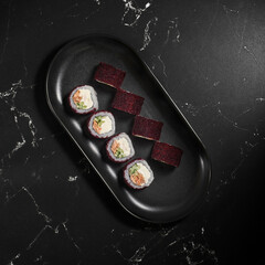 California sushi roll with crab meat, avocado and masago caviar. Close up view