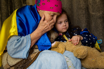 War in Ukraine. A woman and a child are hiding in the basement because of the war. The family hides...