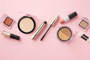 Make up concept. Top view photo of lipstick compact powder blush eyeshadow brushes nail polish and...