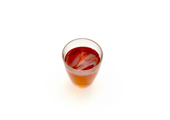 glass glass with tea on a light background
