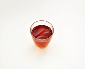 glass glass with tea on a light background