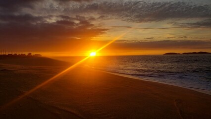 Fototapeta na wymiar sun sunset sea bike boat cloud sand
