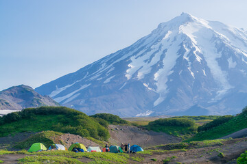 Fototapeta premium Tents at the foot of Koryaksky volcano