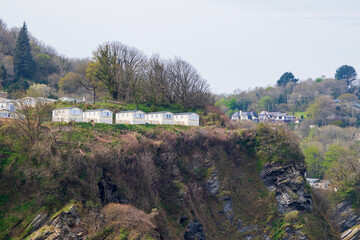 Naklejka premium Camping on a cliff. Small holiday houses outside of a town