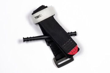 Hemostatic tourniquet on a white background top view. A tourniquet to stop bleeding. Bandaging the wounded.