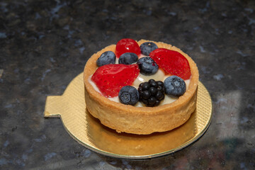 Sweet berry pie filled with vanilla cream