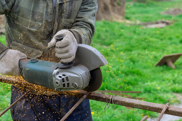 Electric wheel saw the cutting metal frame on fountain of sparks
