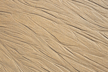 sand texture with diagonal lines. holiday background. maritime motifs background.