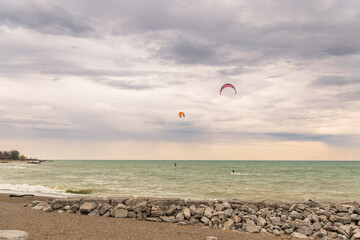 	
Kite boarders riding an east wind on an overcast morning in Toronto's Beaches neighbourdood shot in early May.