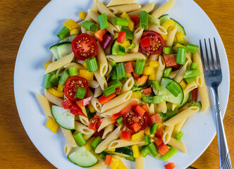 penne pasta salad with tomatoes and vegetables