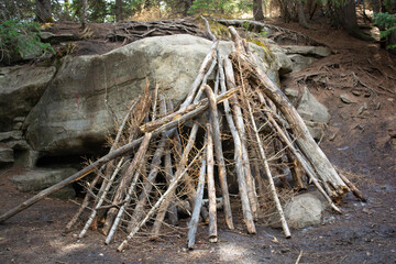 Lean-to Wood Shelter on Overhanging Rock Cave