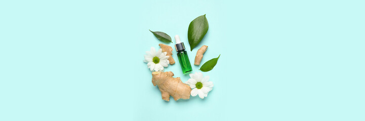 Fototapeta na wymiar Bottle of natural serum, flowers, ginger and green leaves on light blue background. Banner for design