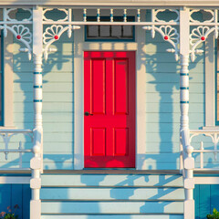 Square Front porch exterior with red front door at Oceanside, California
