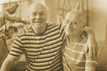 Fototapeta premium Old photo of happy elderly men at home