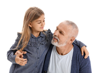 Senior man with his little granddaughter hugging on white background