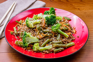 Buckwheat noodles with vegetables ,soba on wooden table, vegetable noodles