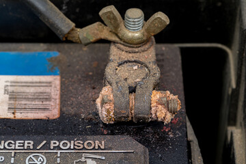 Battery terminal corrosion on automotive battery. Car repair, vehicle maintenance and service concept.