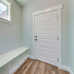 Square Mudroom interior with a seating area with shoe storage at the bottom