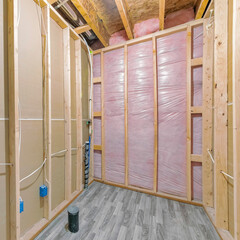 Square Unfinished bathroom construction with woodframes and wooden flooring