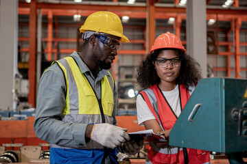 Industrial factory and manufacturing concept. Engineering with technician inspect the production of...