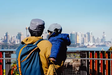 Foto op Canvas Australian family man and boy looking enjoy beautiful landscape view of Sydney cityscape, Australia. Travel or tourism concept. © sakarin14