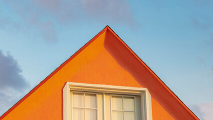 Panorama Puffy clouds at sunset Orange gable roof with attic at Oceanside, California